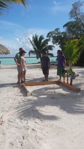 Playing horseshoes in front of Blackbeards Bar in Cerros Sands, Corozol, Belize – Best Places In The World To Retire – International Living